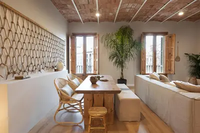a living room with a couch and a table at Malay - 3 bedrooms in Eixample Dreta in Barcelona