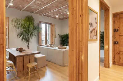a living room with a couch and a table at Malay - 3 bedrooms in Eixample Dreta in Barcelona