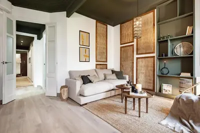 a dining room with a table and a potted plant at Lendu - 2 bedrooms and balcony in Sant Antoni in Barcelona