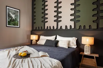 a bedroom with a bed with a tray of fruit on it at Lendu - 2 bedrooms and balcony in Sant Antoni in Barcelona