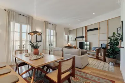 a living room with a table and a couch at Karakoy - 2 bedrooms and balcony in Eixample Dreta in Barcelona