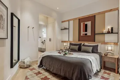 a living room with a couch and a tv at Karakoy - 2 bedrooms and balcony in Eixample Dreta in Barcelona