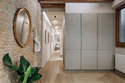 a living room with a couch and a table at Sande - 2 bedrooms and balcony in Eixample Dreta in Barcelona