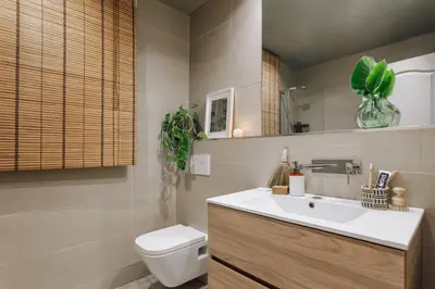 a hallway with white cabinets and a brick wall at Sande - 2 bedrooms and balcony in Eixample Dreta in Barcelona