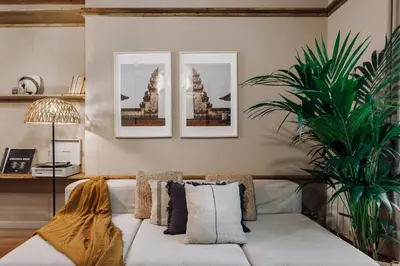 a tray with bowls of food on a bed at Sande - 2 bedrooms and balcony in Eixample Dreta in Barcelona