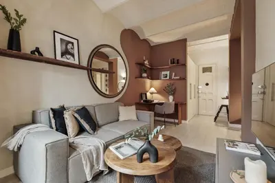 a living room with a couch and a mirror at Sinan - 2 bedrooms and balcony in Sant Gervasi in Barcelona
