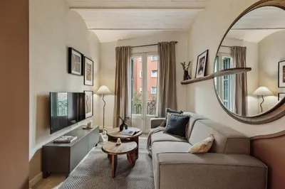 a kitchen with a table and a dining room at Sinan - 2 bedrooms and balcony in Sant Gervasi in Barcelona