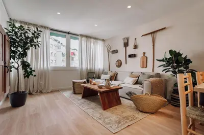 a bedroom with a large bed with a tray on it at Jaen - 2 bedrooms and office in Sant Gervasi in Barcelona
