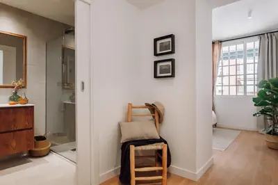 a home office with a wooden desk and a chair at Jaen - 2 bedrooms and office in Sant Gervasi in Barcelona