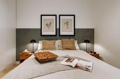a bedroom with a large bed with a basket on it at Jaen - 2 bedrooms and office in Sant Gervasi in Barcelona