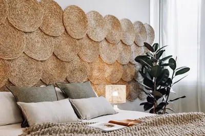 a room with a bed with a wall made of discs at Genave - 2 bedrooms in Eixample Esquerra in Barcelona