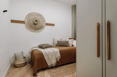 a kitchen with a plant and stools in a room at Genave - 2 bedrooms in Eixample Esquerra in Barcelona