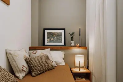 a living room with a couch and a tv at Genave - 2 bedrooms in Eixample Esquerra in Barcelona