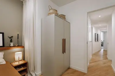 a dining room with a table and potted plants on the wall at Genave - 2 bedrooms in Eixample Esquerra in Barcelona