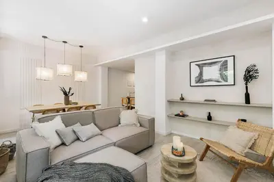 a bedroom with a large bed with a book on it at Palinuro - 3 bedrooms in Sant Antoni in Barcelona