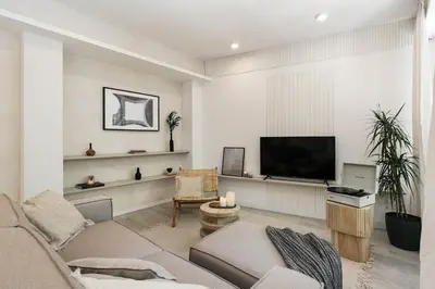 a living room with a couch and a table at Palinuro - 3 bedrooms in Sant Antoni in Barcelona