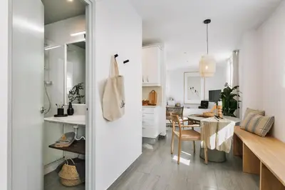 a living room with a couch and a table at Soffio - Studio and terrace in Gràcia in Barcelona