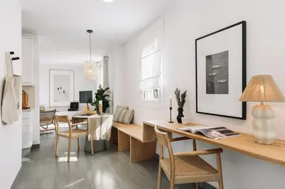 a kitchen and dining room with a table and a dining room at Soffio - Studio and terrace in Gràcia in Barcelona