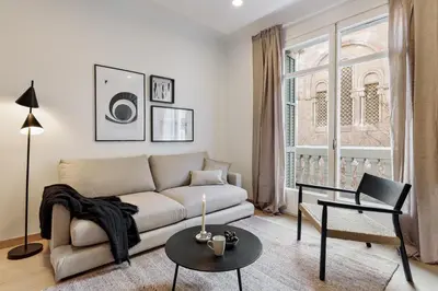 a bedroom with a large white bed with two lamps at Costa - 3 bedrooms, balcony in Eixample Esquerra in Barcelona