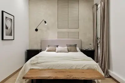 a living room with a table and chairs and a television at Costa - 3 bedrooms, balcony in Eixample Esquerra in Barcelona