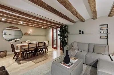 a dining room with a table with chairs and a mirror at Vila - 3 bedrooms and office in El Born in Barcelona