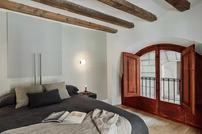 a kitchen with a table and chairs in a room at Vila - 3 bedrooms and office in El Born in Barcelona