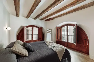 a kitchen with a table and chairs in a room at Vila - 3 bedrooms and office in El Born in Barcelona