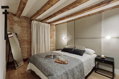 a living room with a couch and a table at Vila - 3 bedrooms and office in El Born in Barcelona