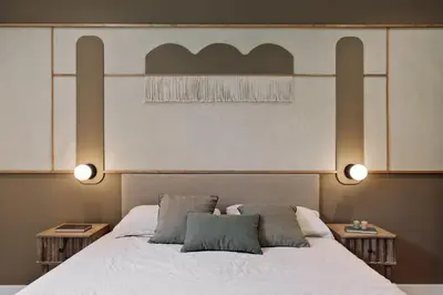 a bedroom with a king sized bed and a table at Peten - 3 bedrooms, terrace and balcony in Gràcia in Barcelona