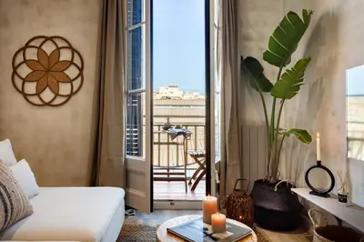 a living room with a couch and a hammock at Natuna - 3 bedrooms in Eixample Esquerra in Barcelona