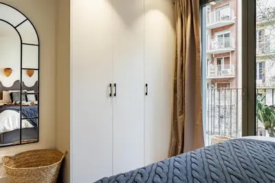 a dining room with a table with fruit on it at Nema - 3 bedrooms balcony in Eixample Esquerra in Barcelona