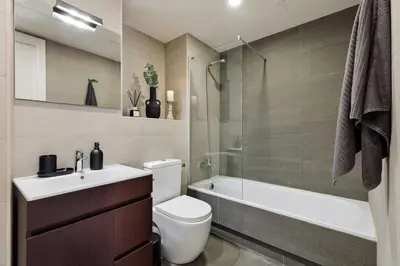 a living room with a kitchen and a dining room at Cervantes - 1 bedroom and pool in Les Corts in Barcelona