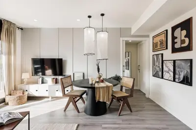 a kitchen with white cabinets and a counter top at Cervantes - 1 bedroom and pool in Les Corts in Barcelona