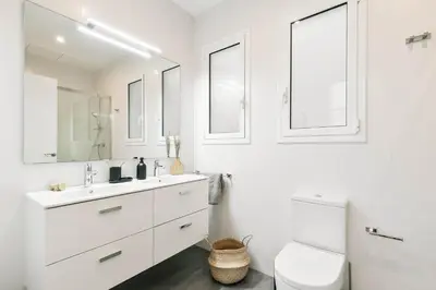 a living room with a couch and a table at Velino - 4 bedrooms and office in Sant Antoni in Barcelona