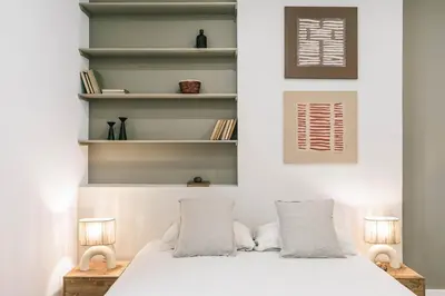 a bedroom with a white bed with two lamps at Velino - 4 bedrooms and office in Sant Antoni in Barcelona