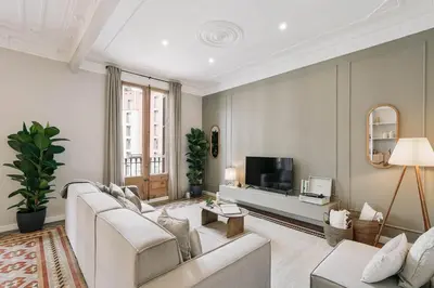 a white bedroom with a large bed and a window at Velino - 4 bedrooms and office in Sant Antoni in Barcelona
