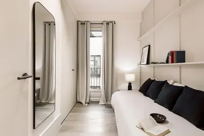 a dining room with a table with chairs and a lamp at Fiore - 2 bedrooms in Ciutat Vella in Barcelona