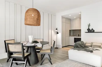 a bedroom with a large white bed with two lamps at Fiore - 2 bedrooms in Ciutat Vella in Barcelona