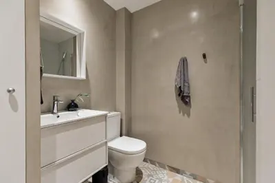 a bedroom with a large bed and a mirror at Malena - 3 bedrooms and terrace in Eixample Esquerra in Barcelona