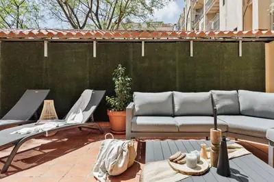 a bathroom with a toilet and a sink and a mirror at Malena - 3 bedrooms and terrace in Eixample Esquerra in Barcelona