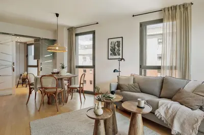 a bedroom with a bed and a large mirror at Altos - 2 bedrooms in El Poblenou in Barcelona