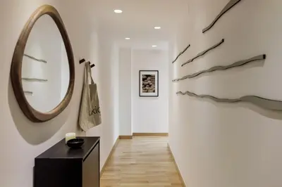a living room with a couch and two tables at Altos - 2 bedrooms in El Poblenou in Barcelona
