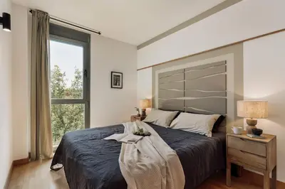 a living room with a couch and a table at Altos - 2 bedrooms in El Poblenou in Barcelona