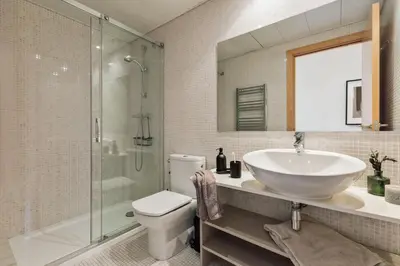 a bedroom with a bed with a bowl of fruit on it at Altos - 2 bedrooms in El Poblenou in Barcelona