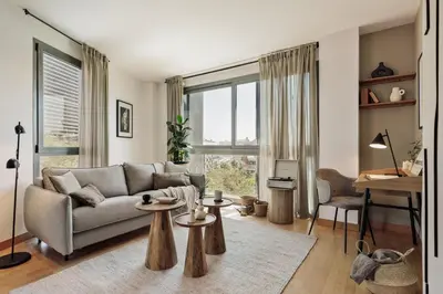 a bedroom with a large bed and a large window at Altos - 2 bedrooms in El Poblenou in Barcelona