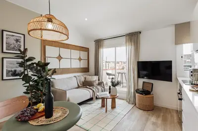 a living room with a couch and a table at Guacimal - 1 bedroom and terrace in Sants in Barcelona