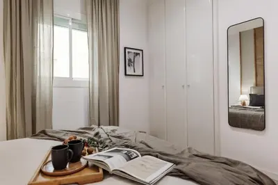 a living room with a table and a plant at Guacimal - 1 bedroom and terrace in Sants in Barcelona