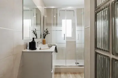 a bedroom with a large bed with a wooden headboard at Guacimal - 1 bedroom and terrace in Sants in Barcelona