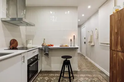 a bedroom with a bed and a desk and a chair at Poblet - 2 bedrooms and balcony in Poblenou in Barcelona