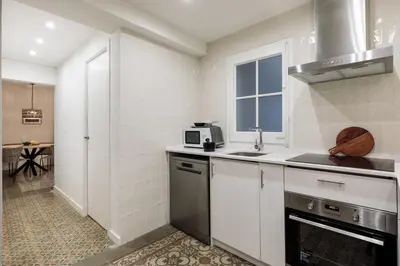 a bedroom with a bed and a painting on the wall at Poblet - 2 bedrooms and balcony in Poblenou in Barcelona